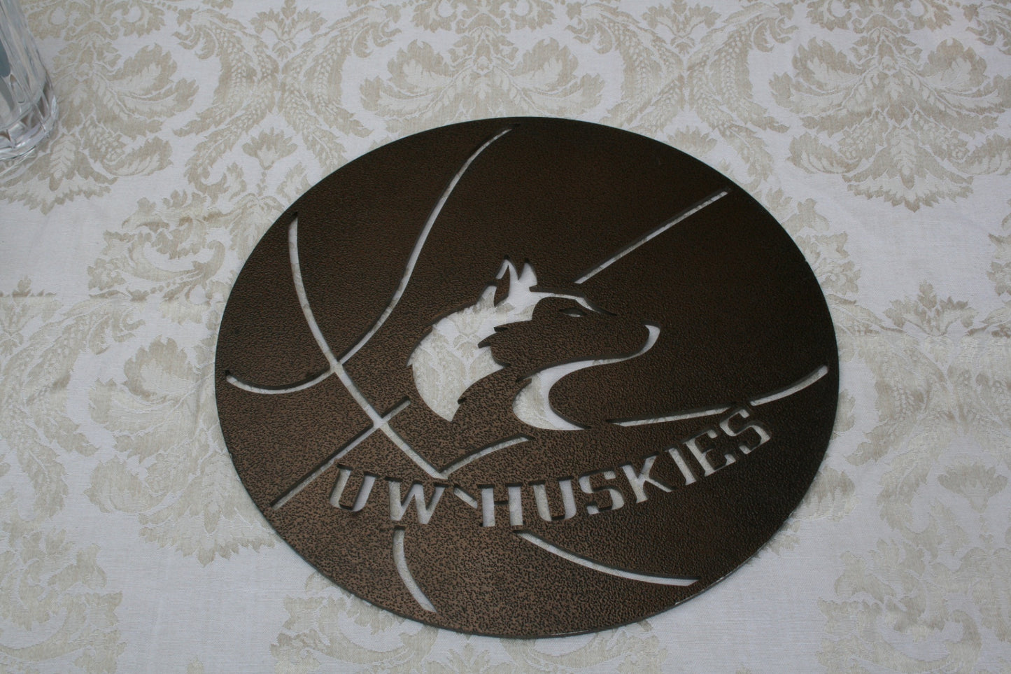 Huskies Metal waterjet cutting sign.