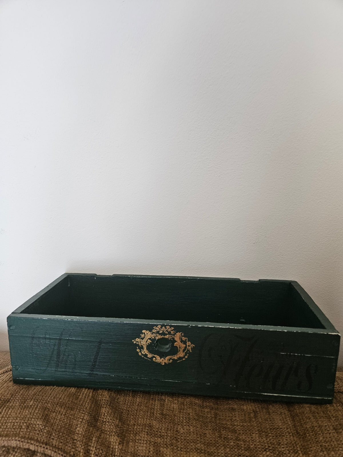 Dark green planter box with gold
