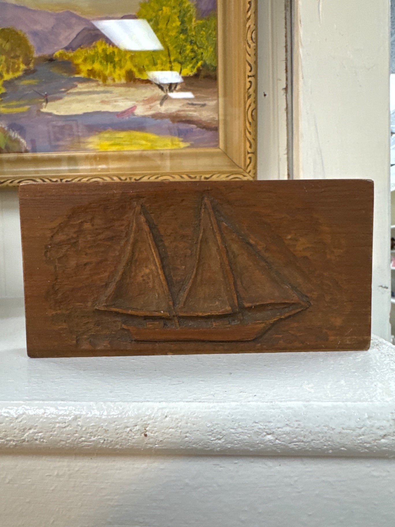 Carved wood sailboat