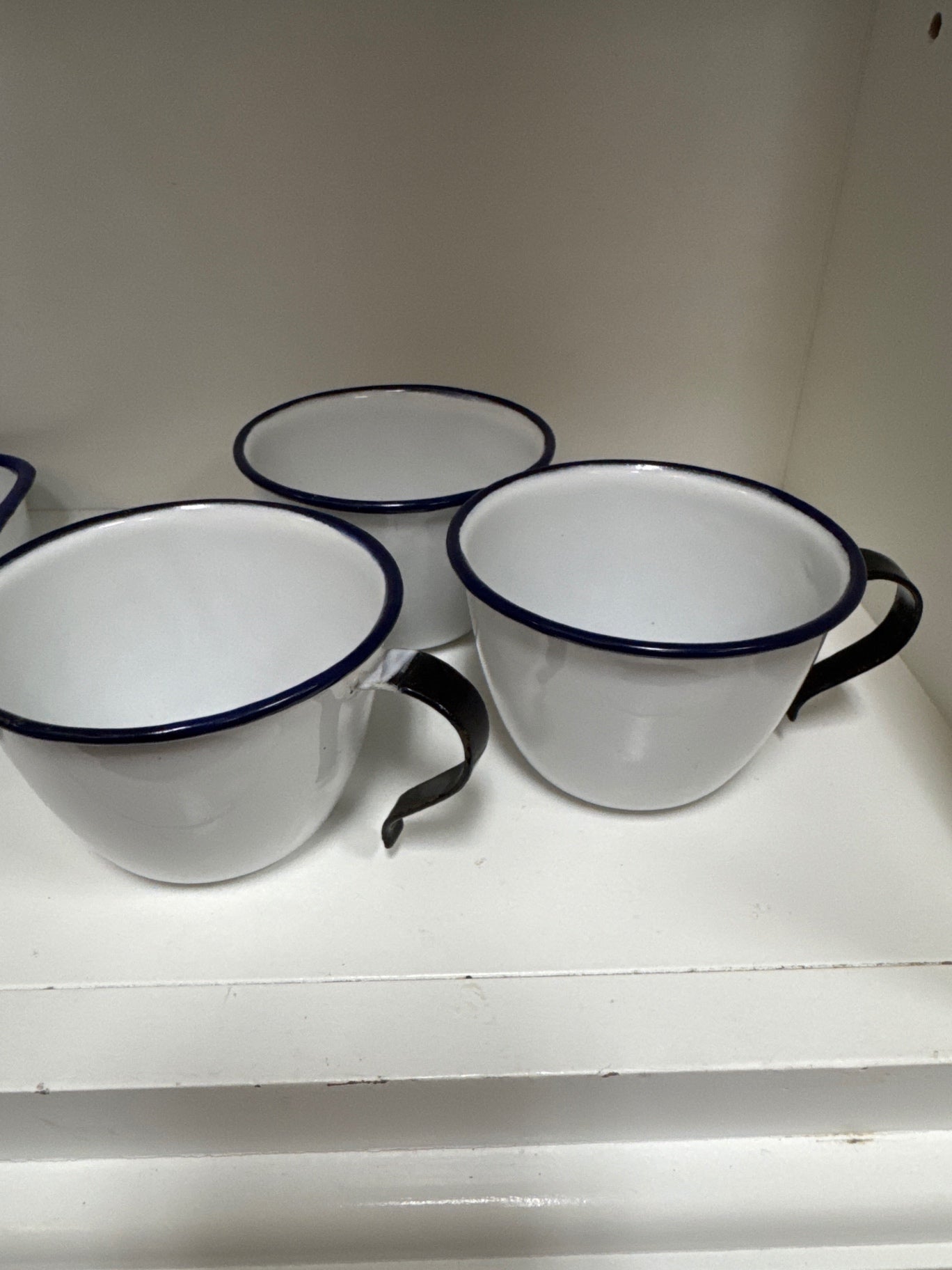 3 white and black enamelwere cups
