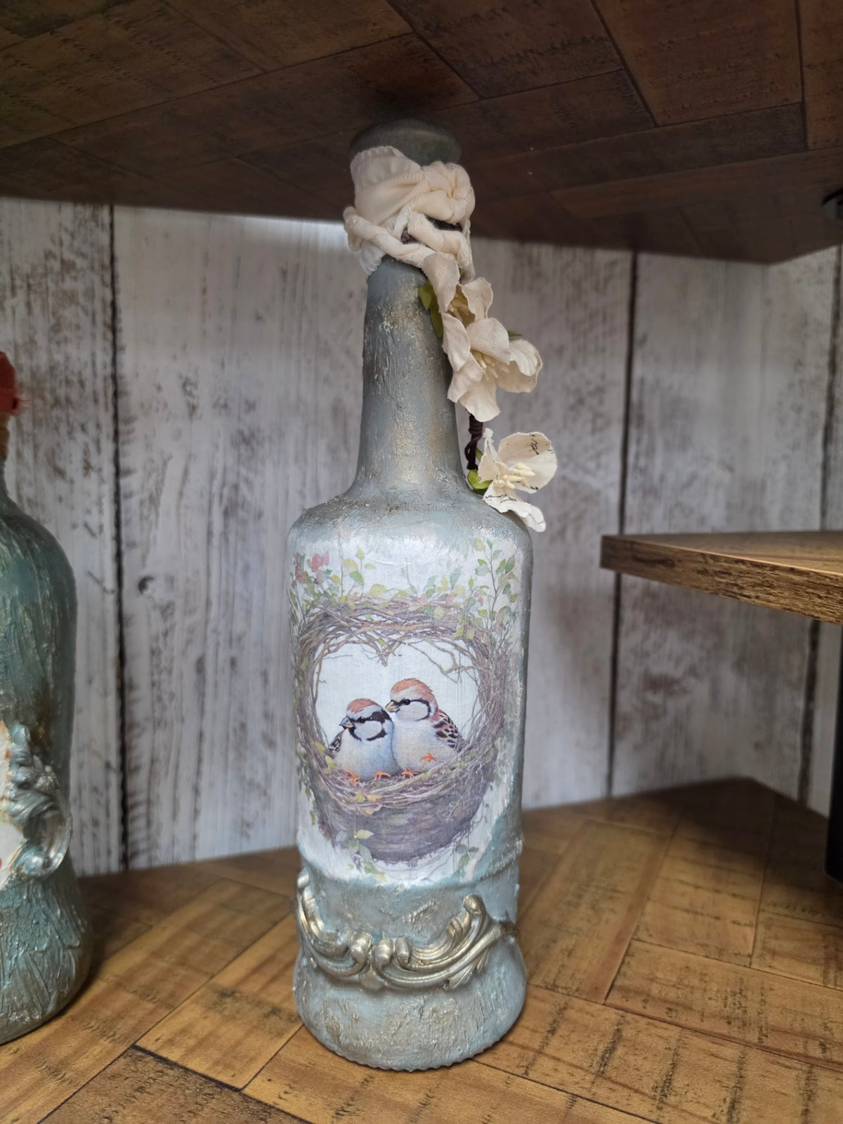 Decoupage bottle with bird