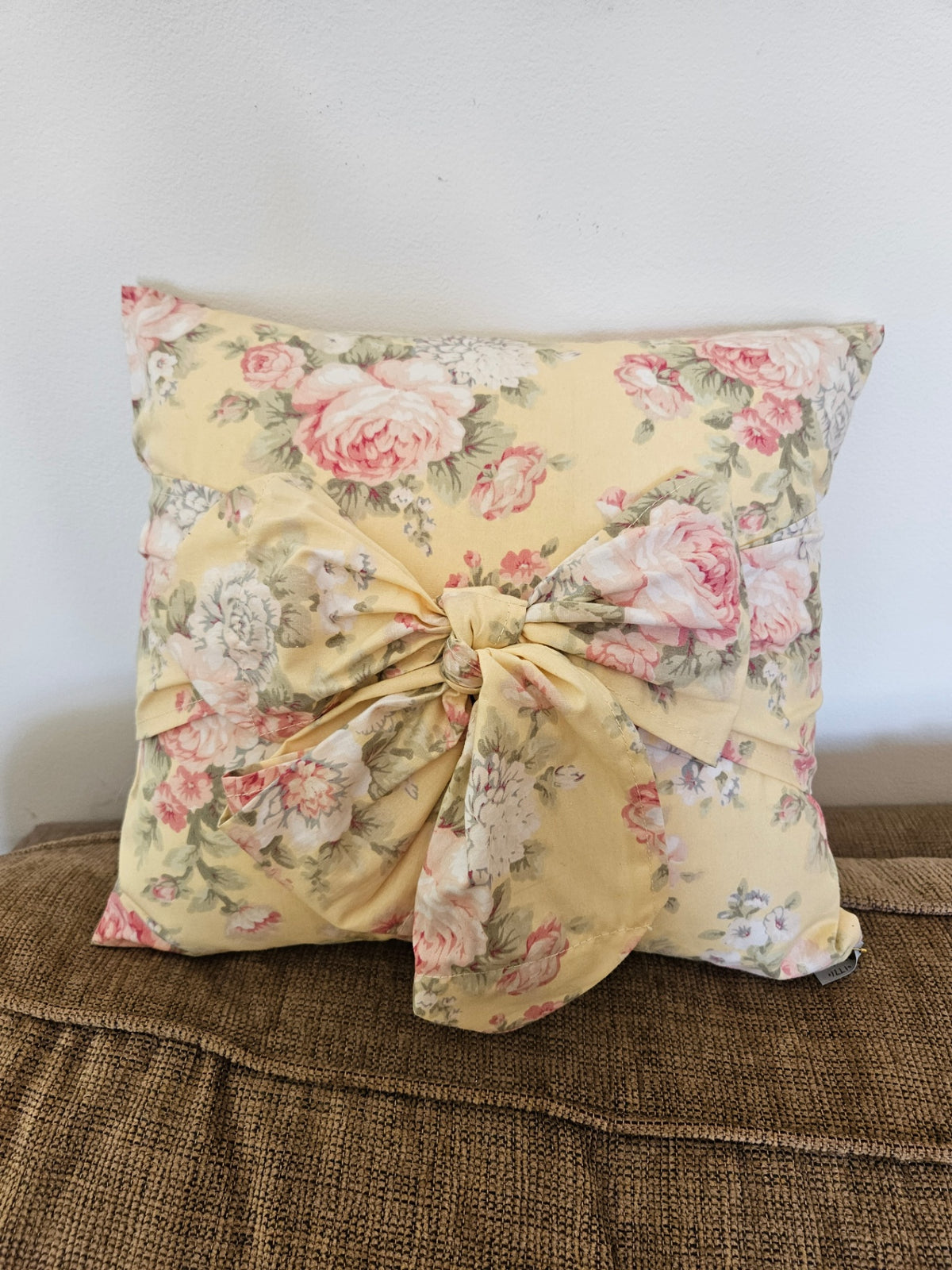 Yellow floral pillow /bow