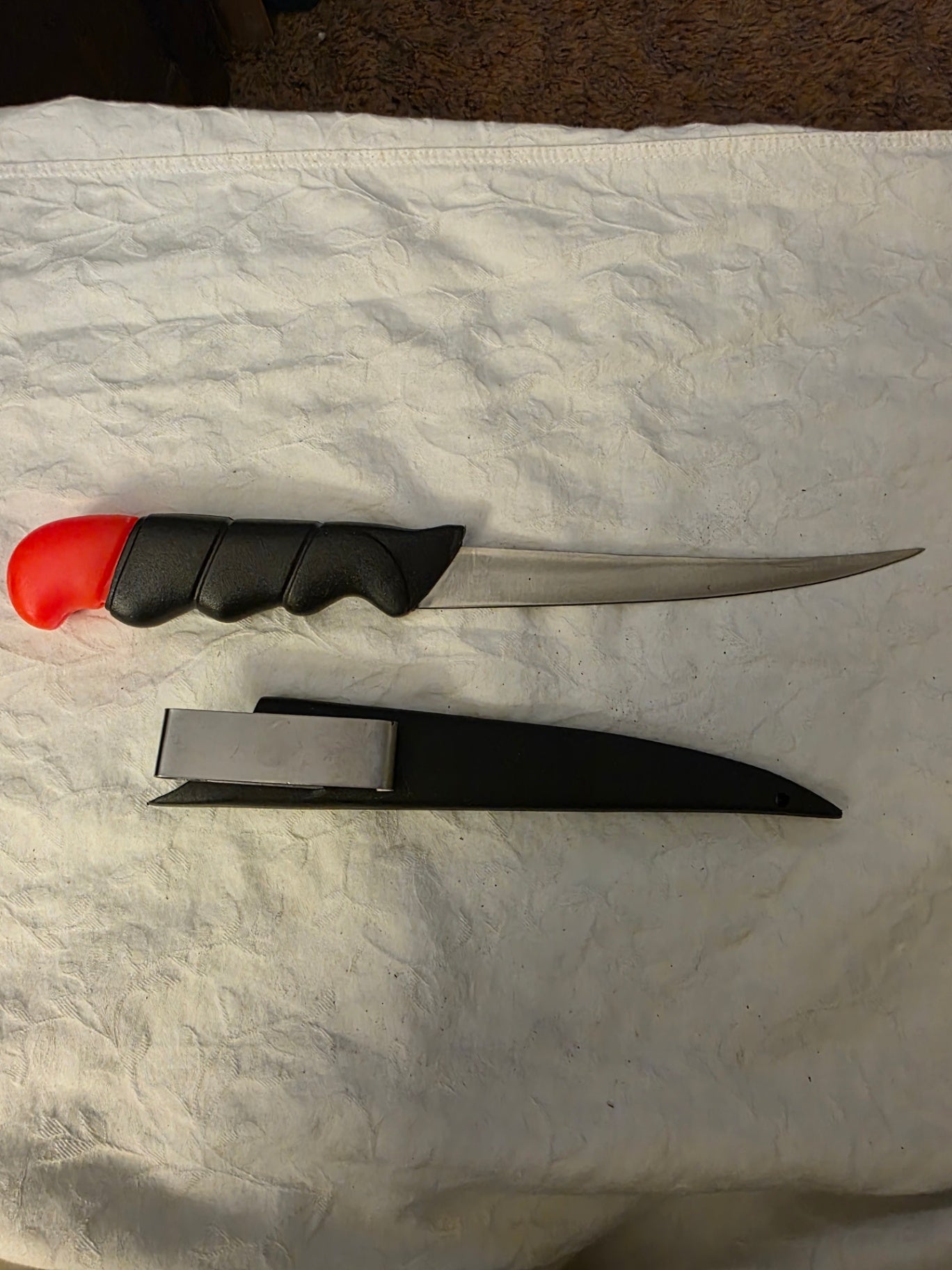 FLOATING FILLET KNIFE WITH SHEATH.