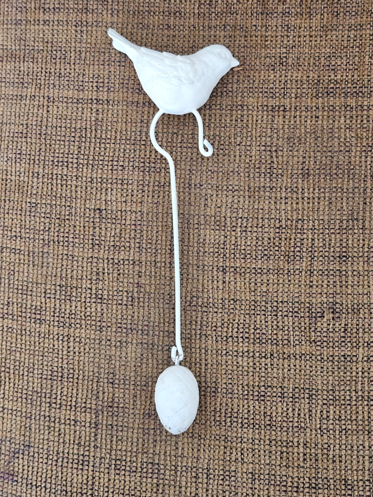 White metal bird with weight