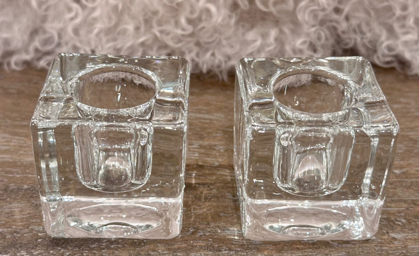 Pair of clear ice cube candle holders