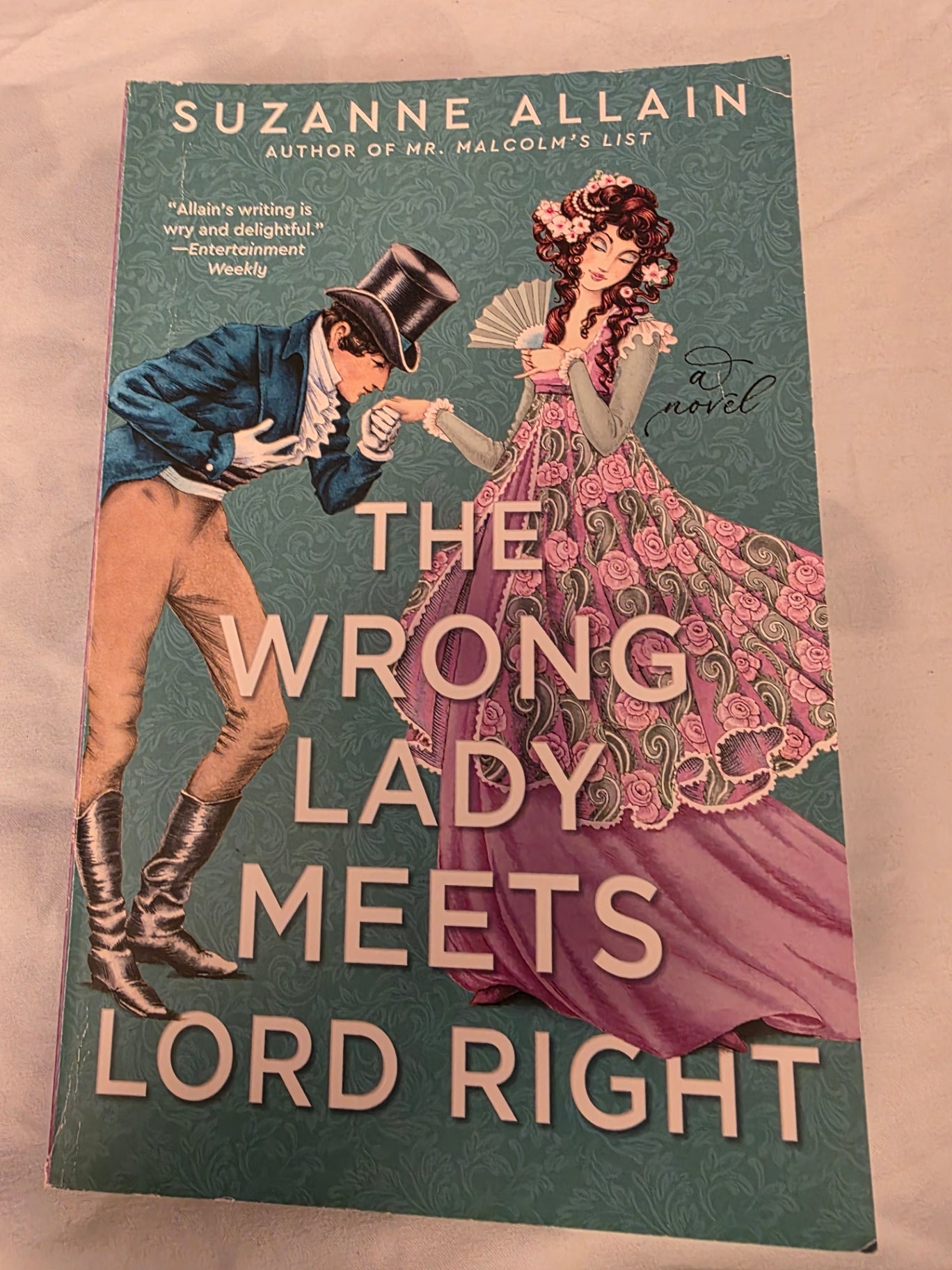 THE WRONG LADY MEETS LORD WRIGHT.