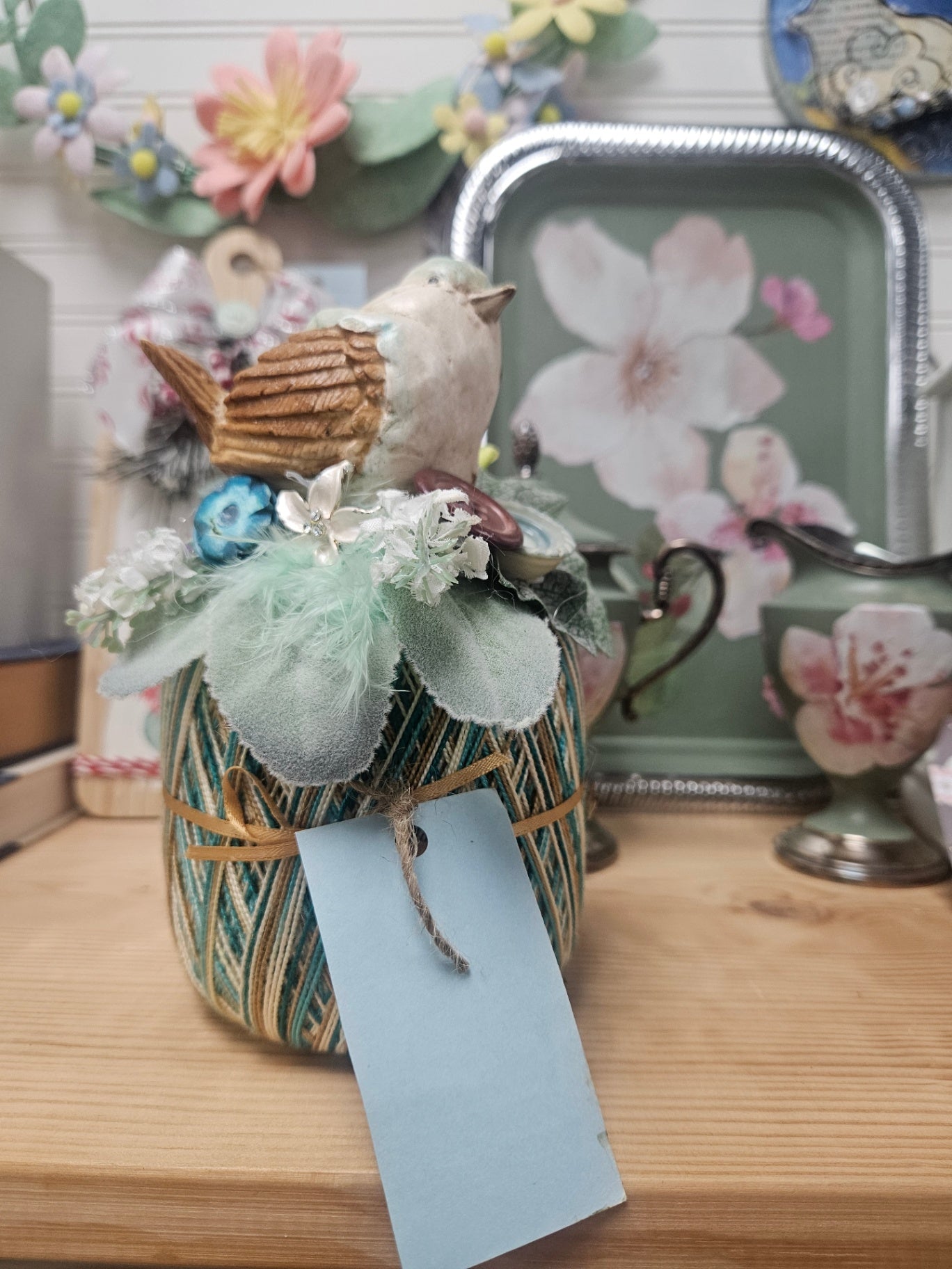 Bird on Green Thread Spool