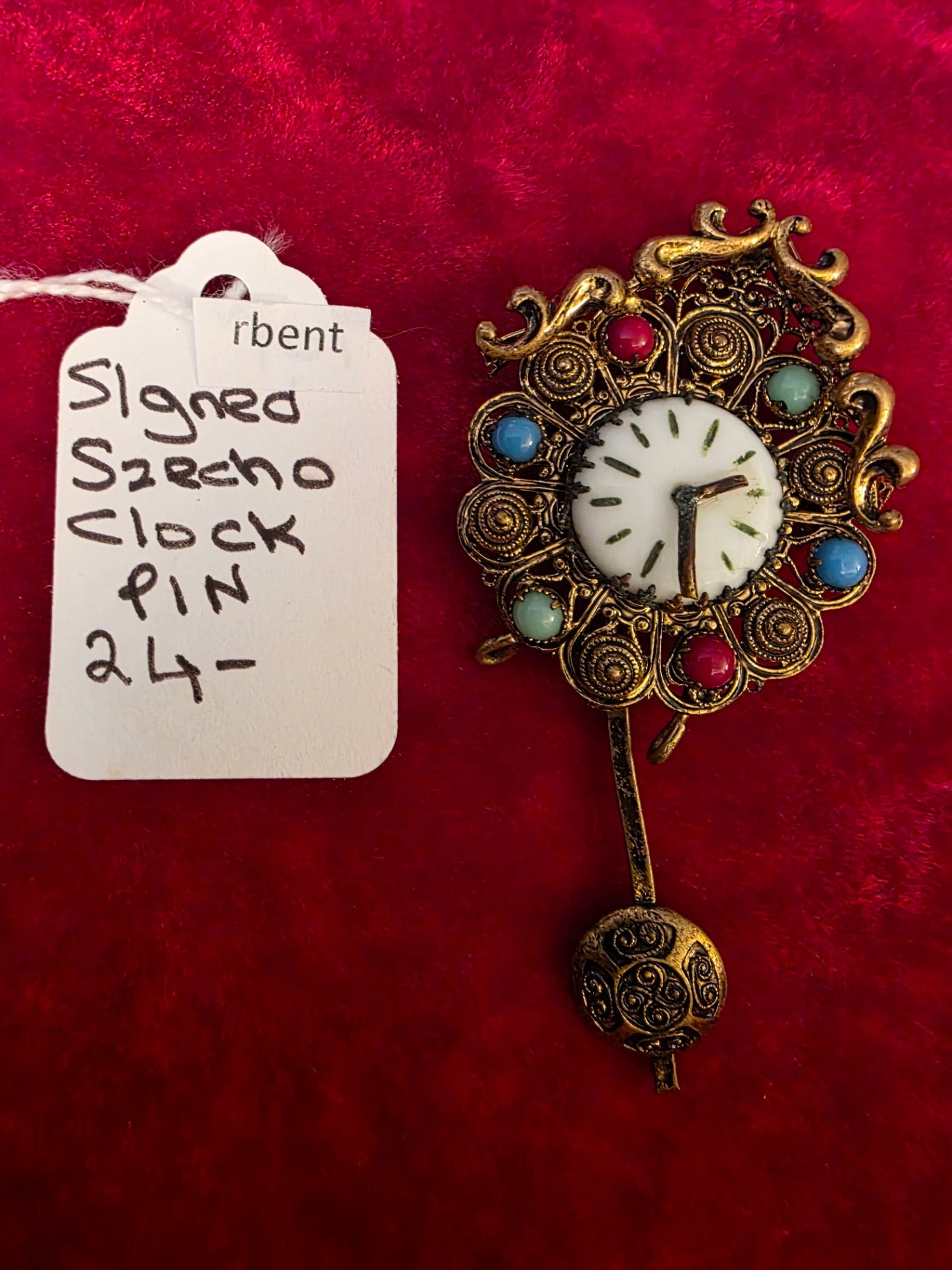 SZECHO CLOCK PIN.