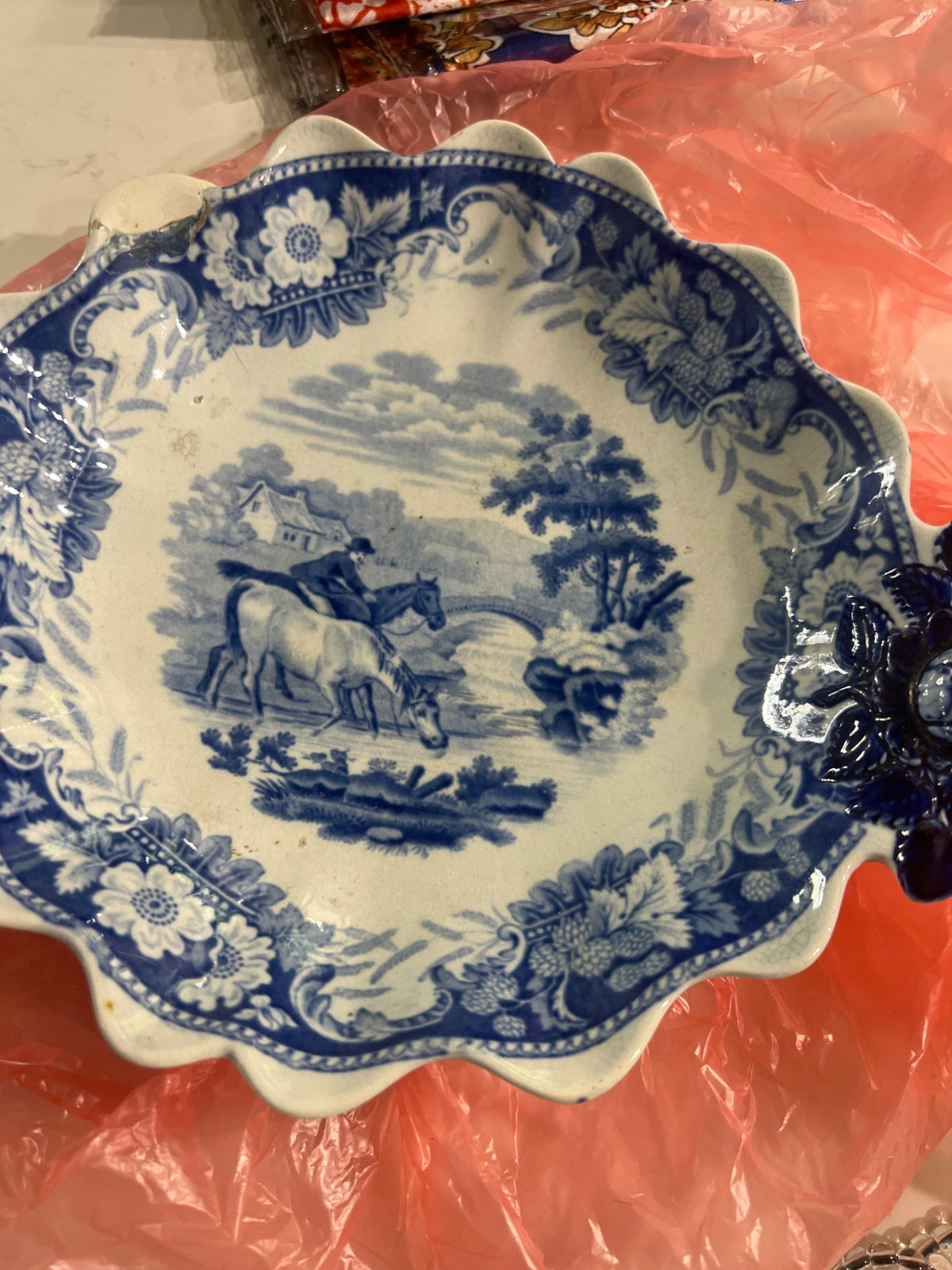 Blue and white dish with horses
