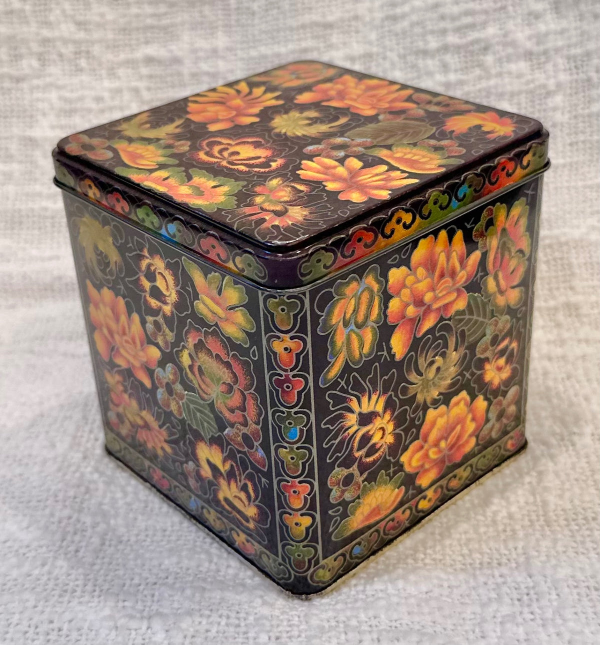 Orange & black vintage floral tin