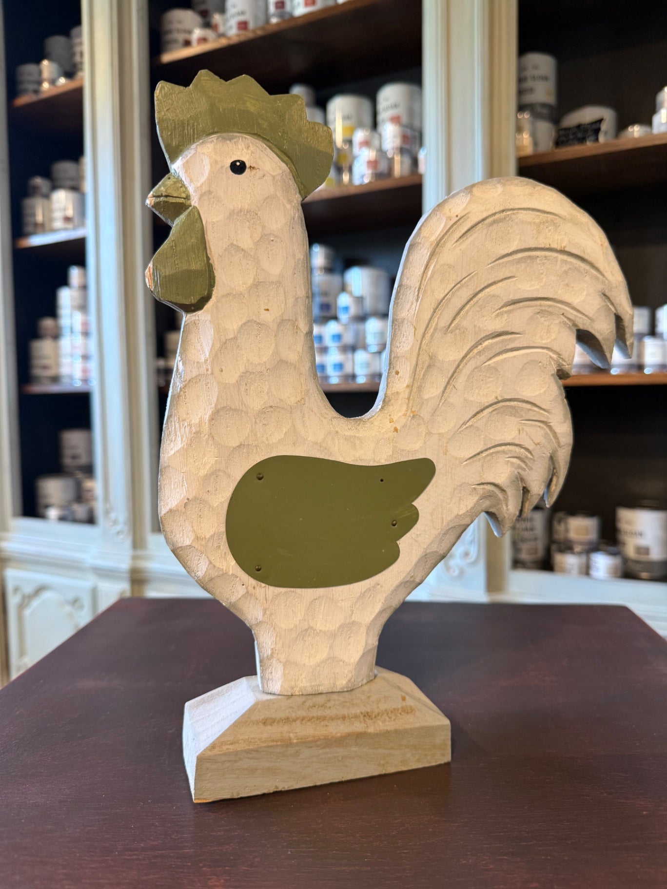White and green carved wooden chicken 