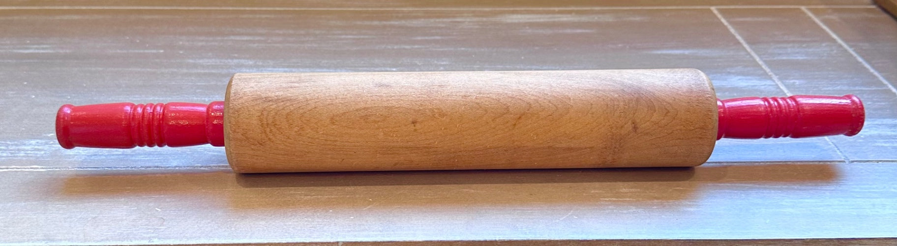 Vintage rolling pin with red handles