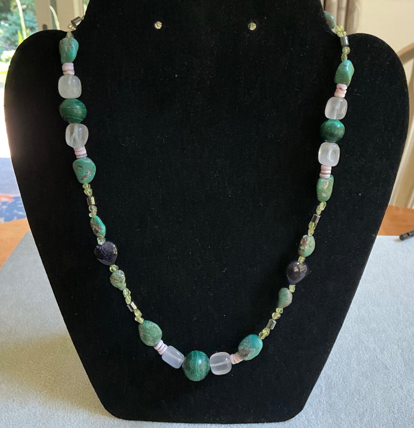 Polished stone & glass necklace. 19” in length.