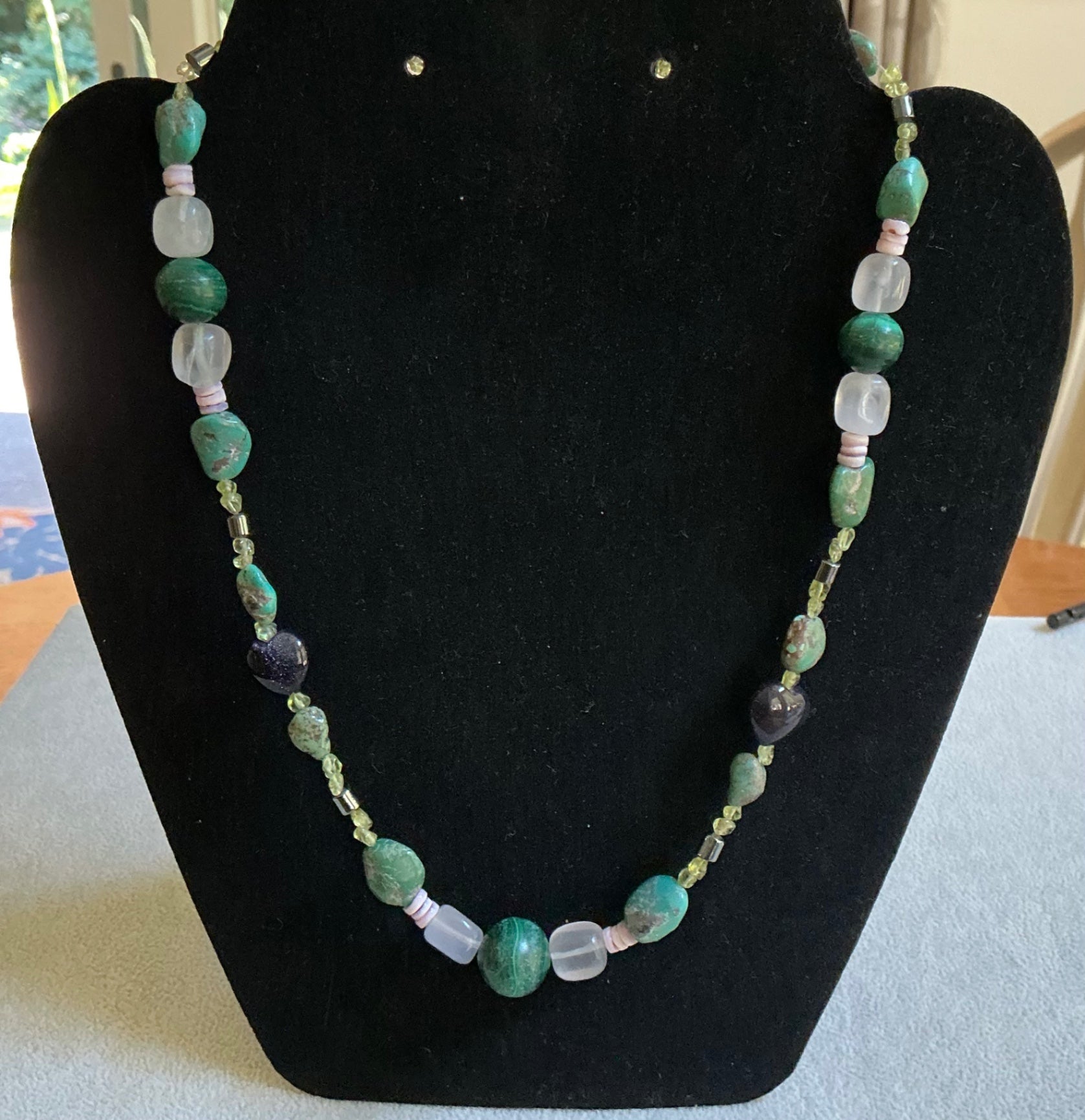 Polished stone & glass necklace. 19” in length.