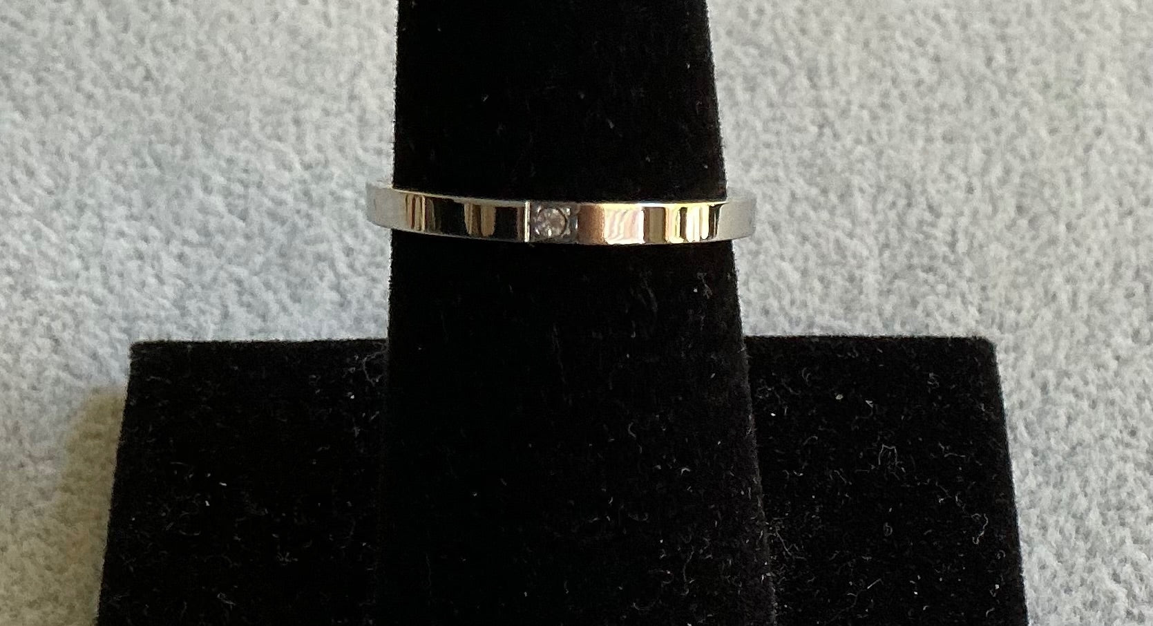 Slim Stainless band w/ a tiny CZ….. size 7
