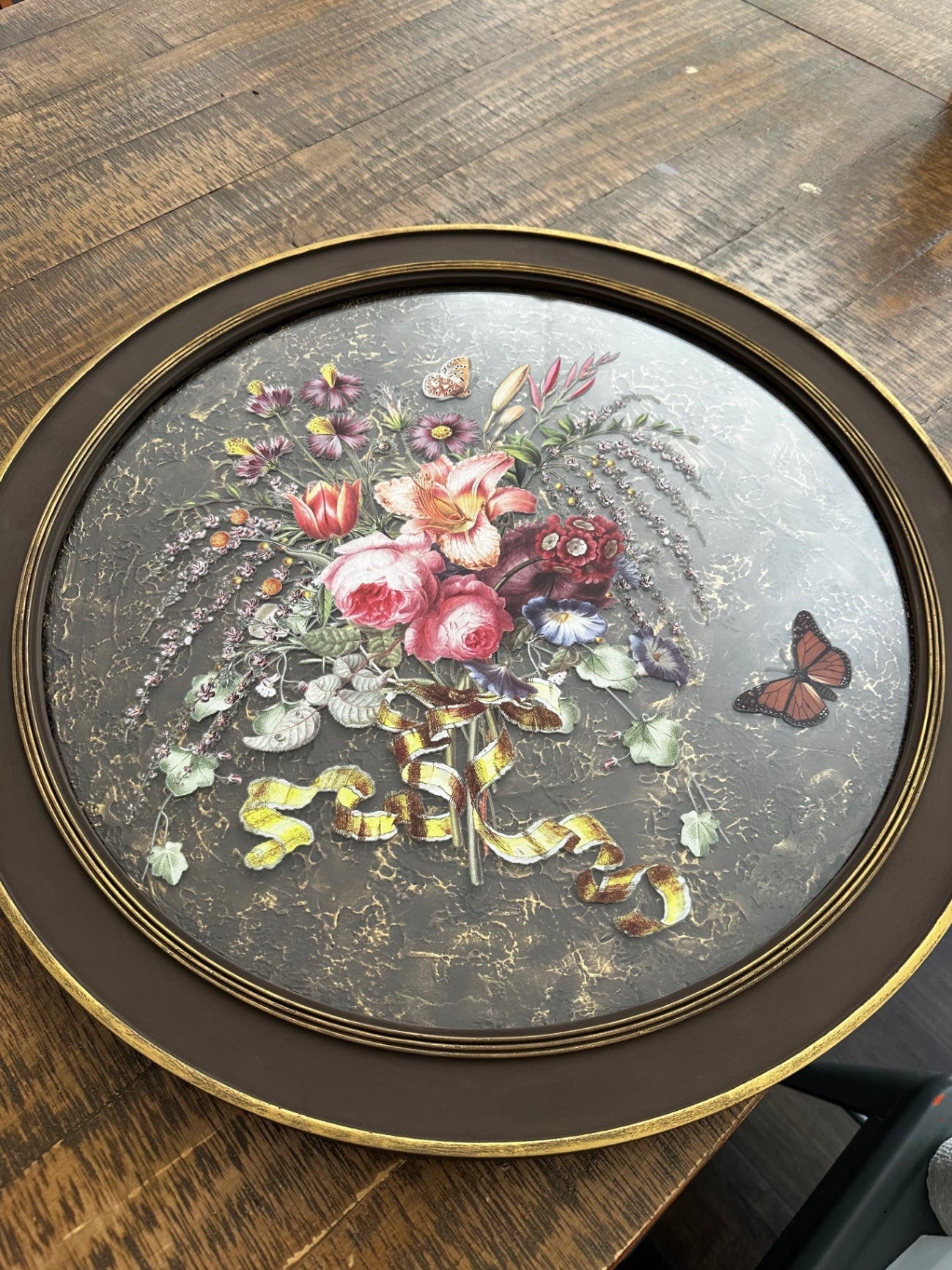 Large round picture with flowers and butterfly