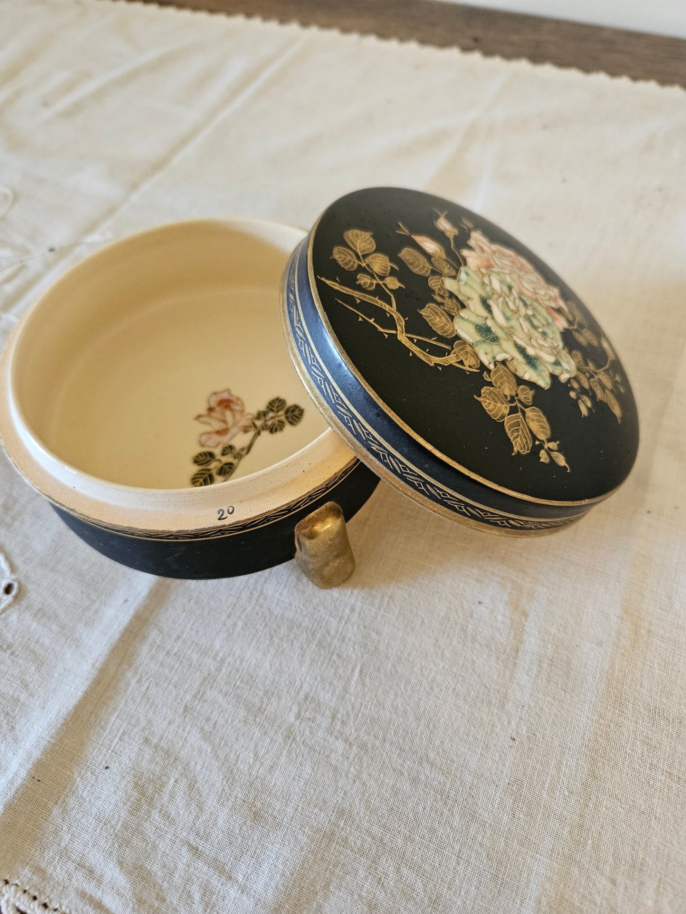 Vintage black covered ceramic trinket dish with floral motif