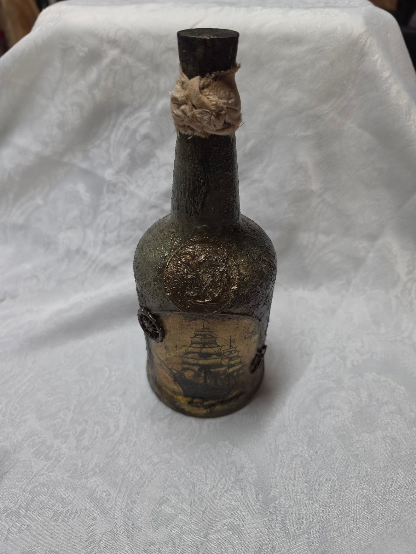 Decoupage bottle with ship