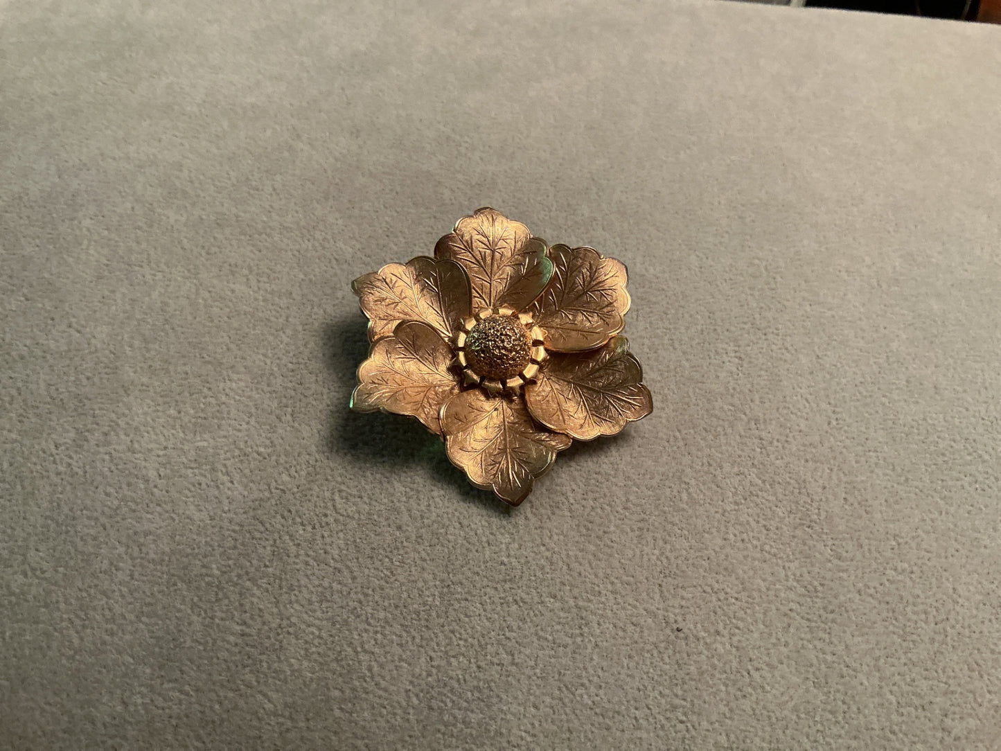 Satin gold tone brooch