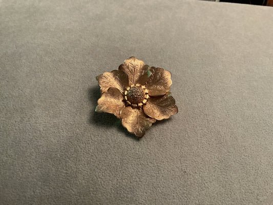 Satin gold tone brooch