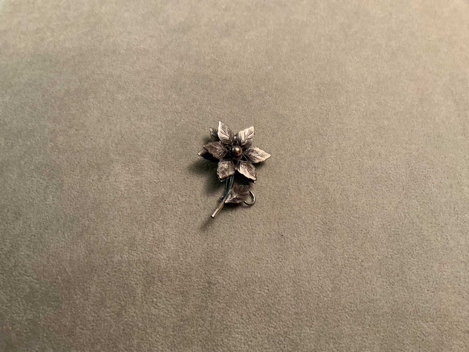 Silver colored flower brooch