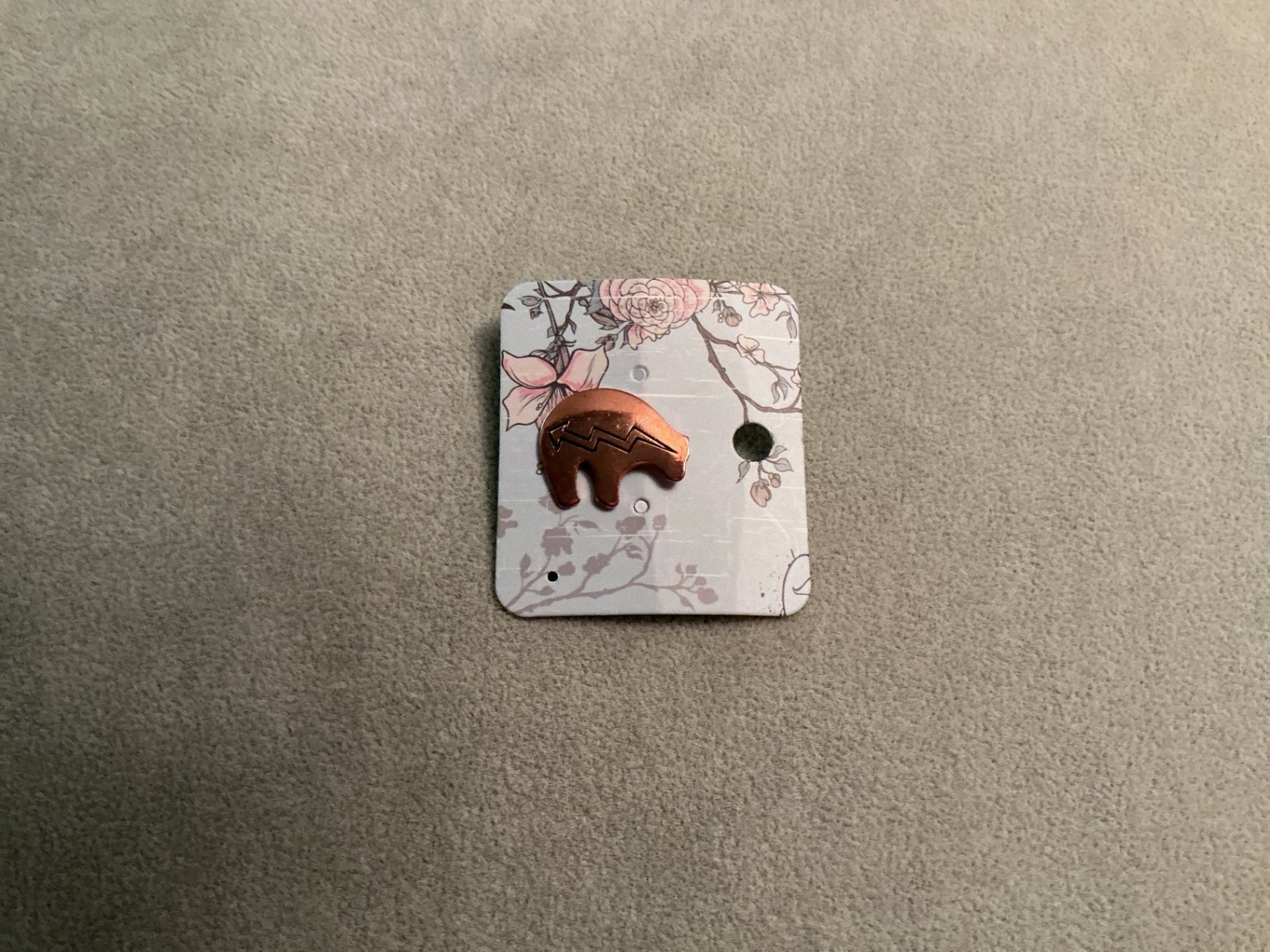 Copper spirit bear label pin