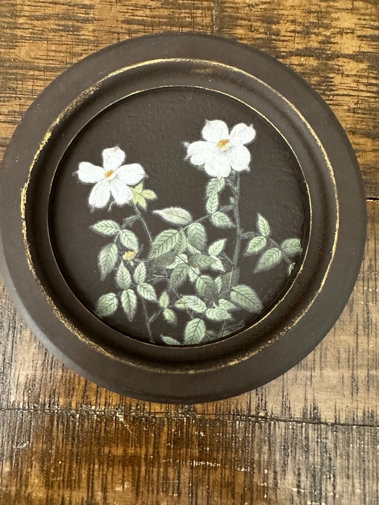 Small brown frame with white flowers 