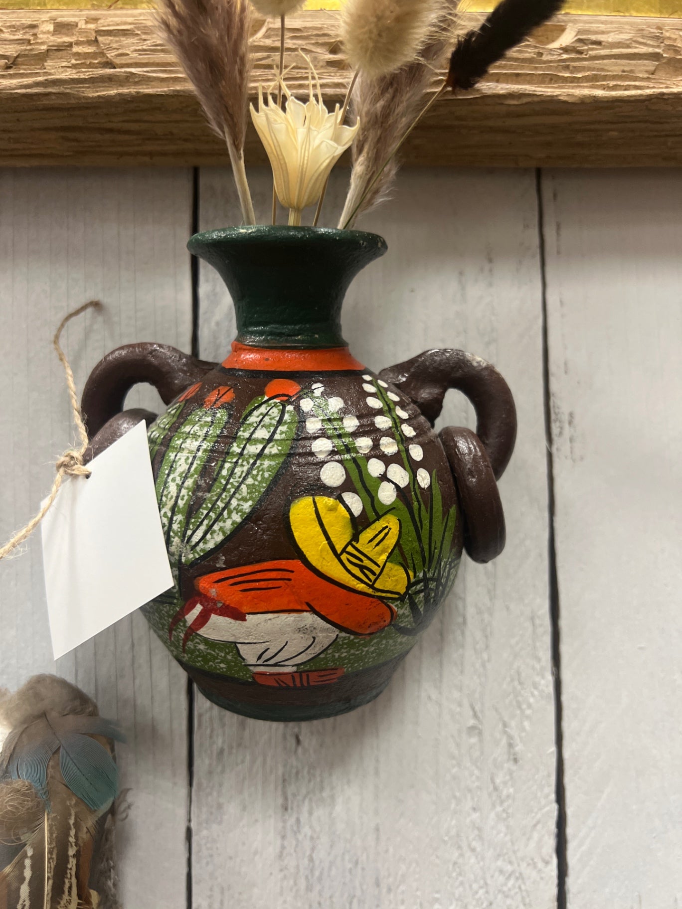 small jug hanging on wall