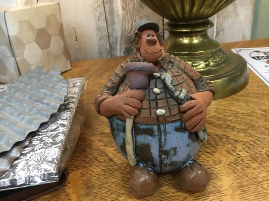 Signed hand crafted plumber figure