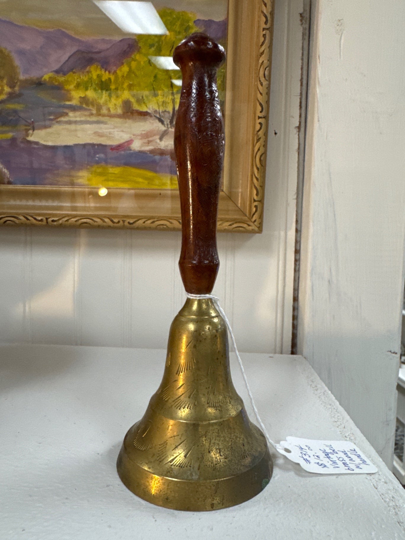 Vintage brass bell with wood