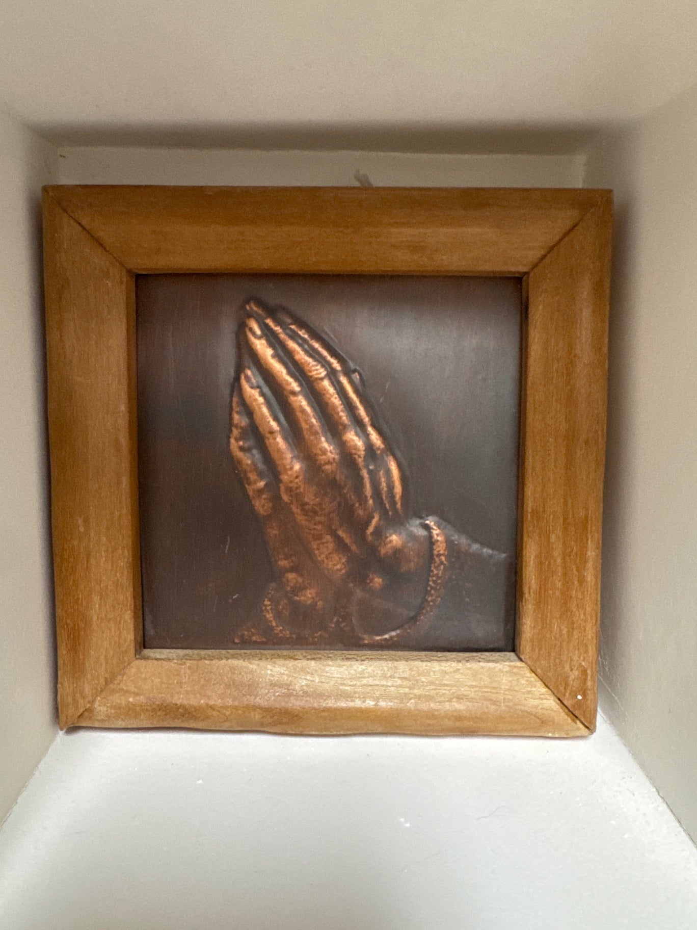 Copper praying hands