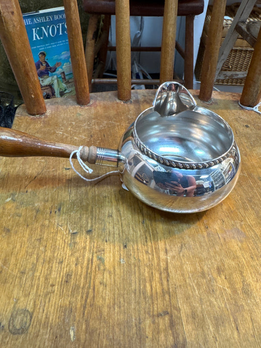 Silver sauce with wood handle