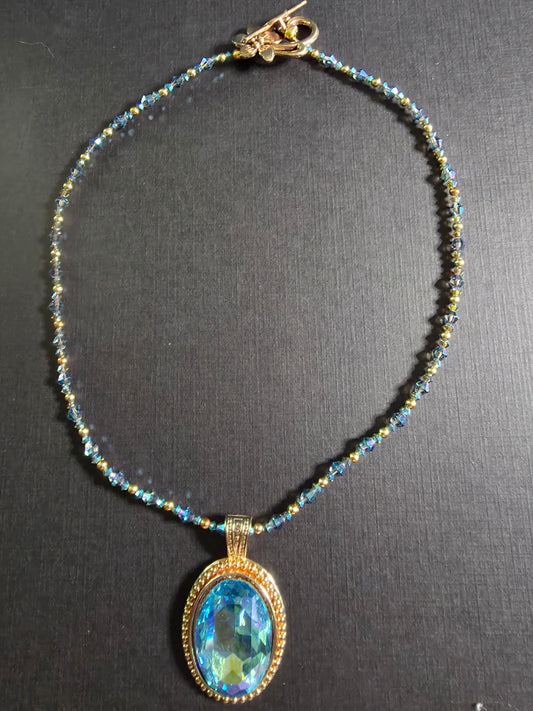 8n blue oval cab set in gold w/crystal beads