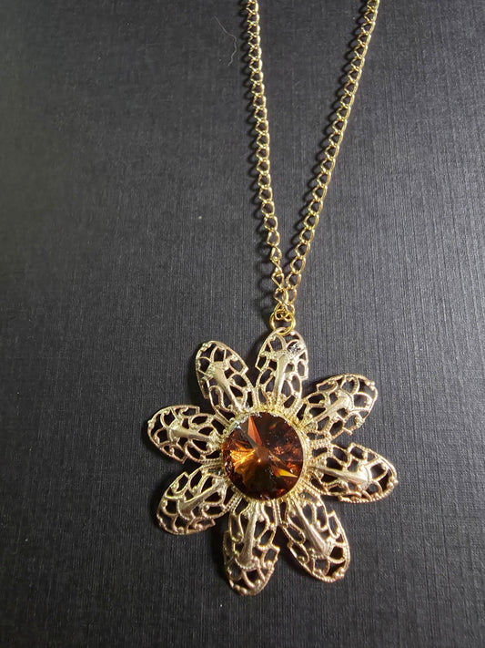6n Gold filigree flower w/brn rivoli