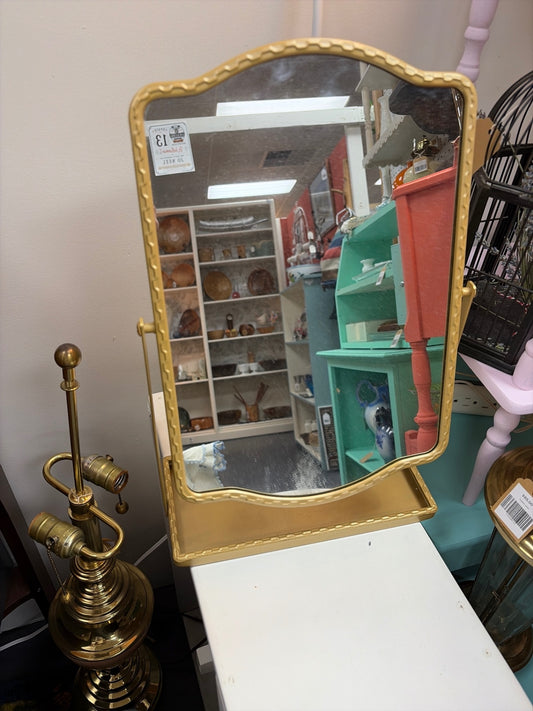 Gold toned mirror