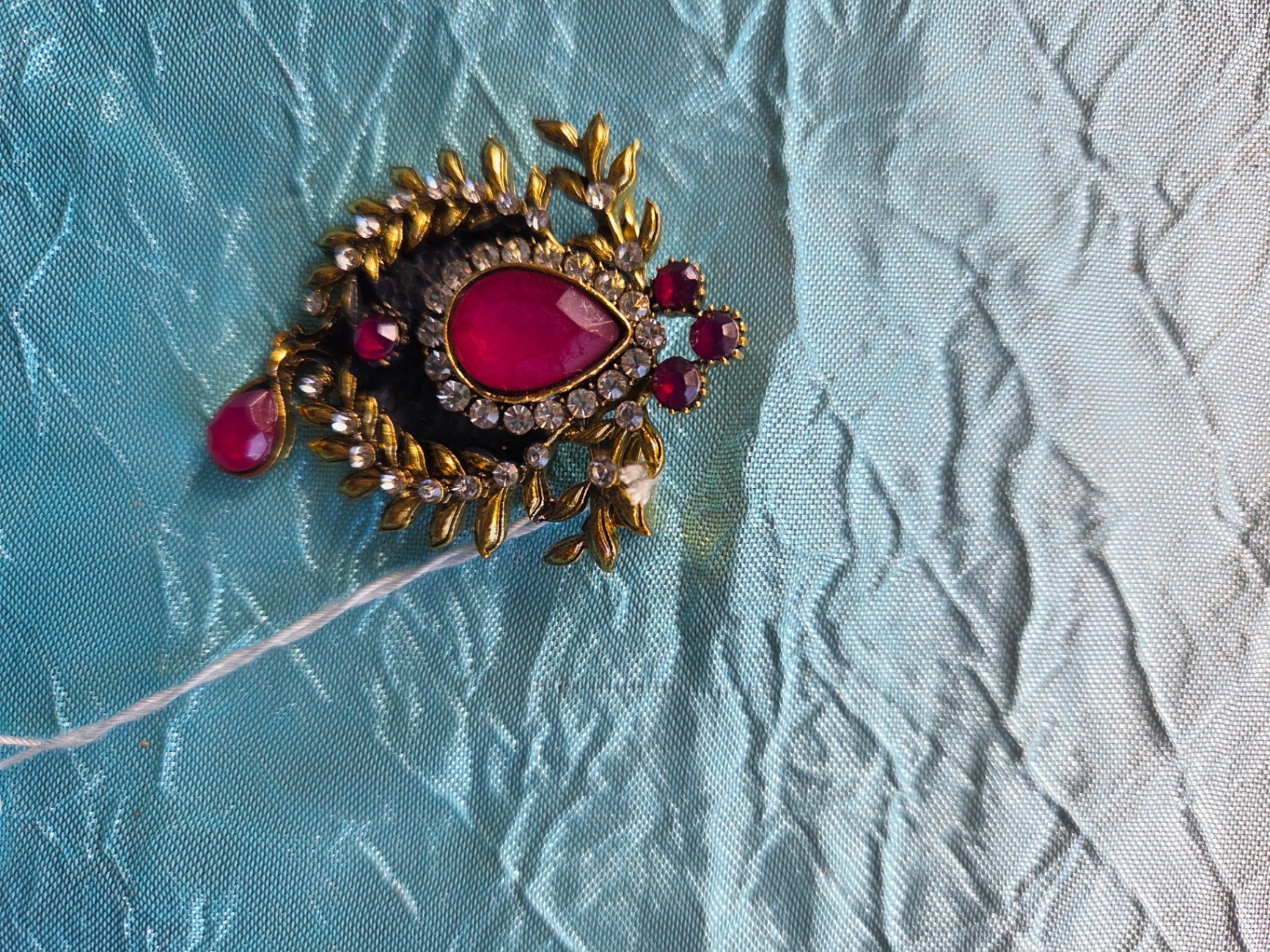 Red gold pin