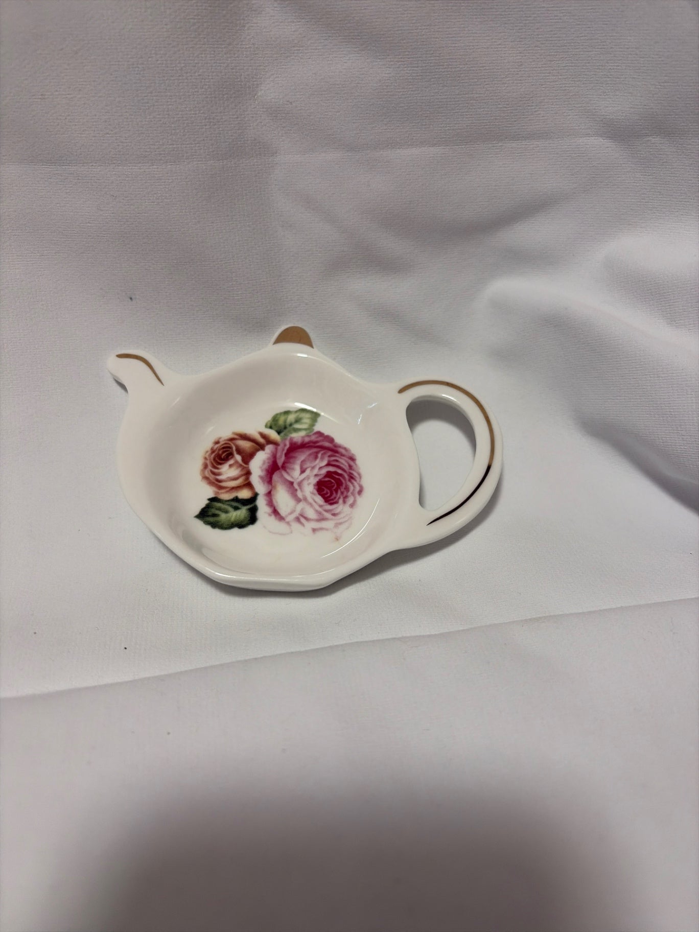 Teapot shaped teabag holder with roses