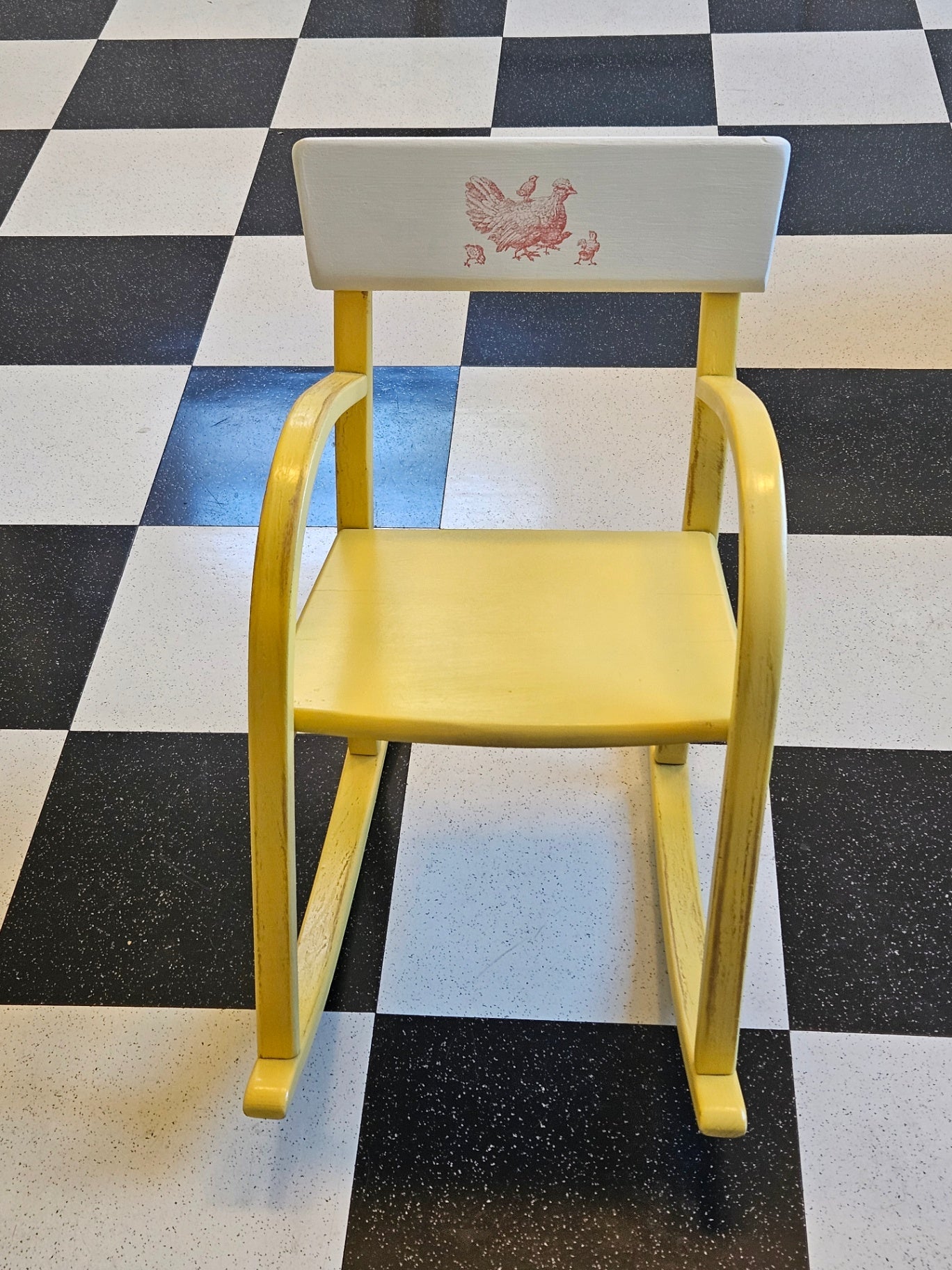 Vintage yellow child's rocking chair