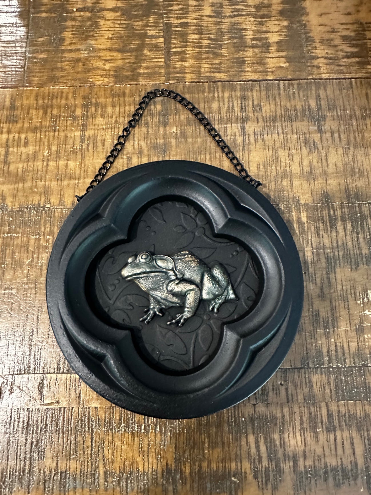 Black frame with frog