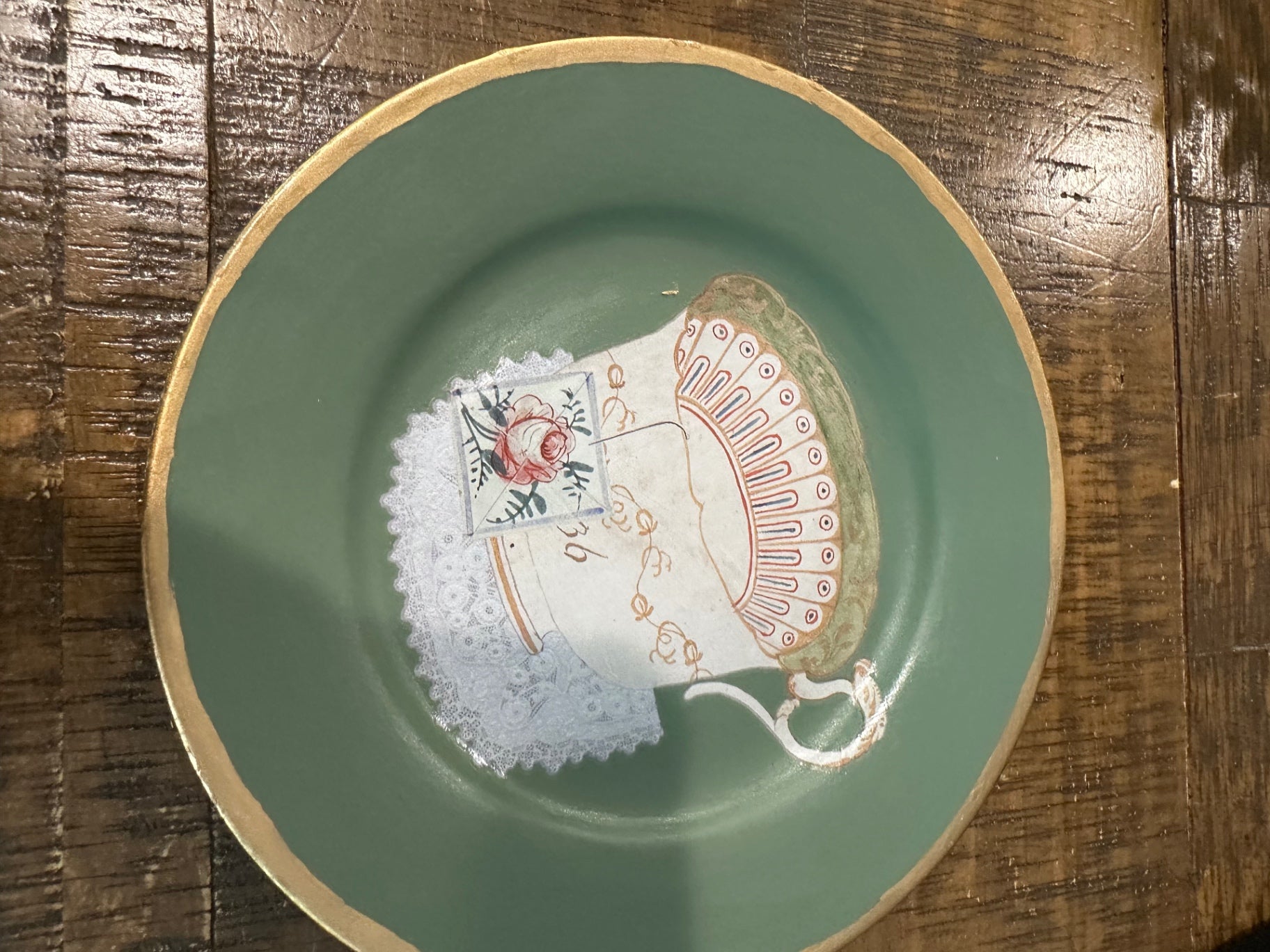 Green plate with tea cup