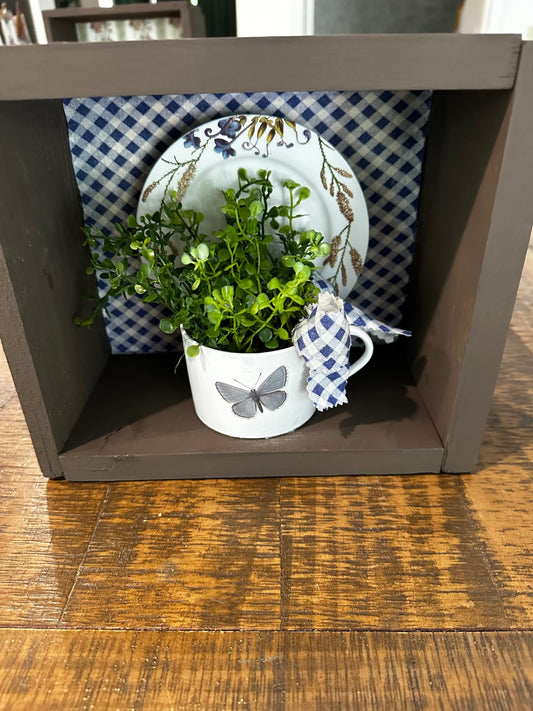 Brown box with tea cup and saucer 