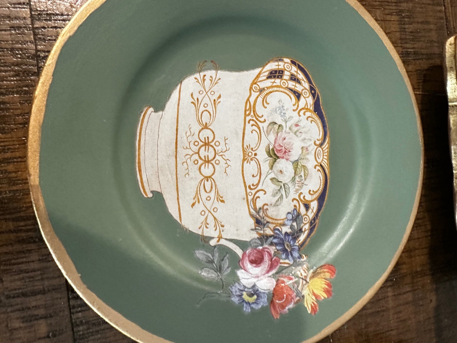 Green plate with tea cup