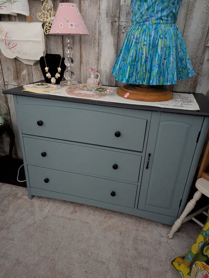 Newer wood and composite dresser painted beautifully blue w/black top