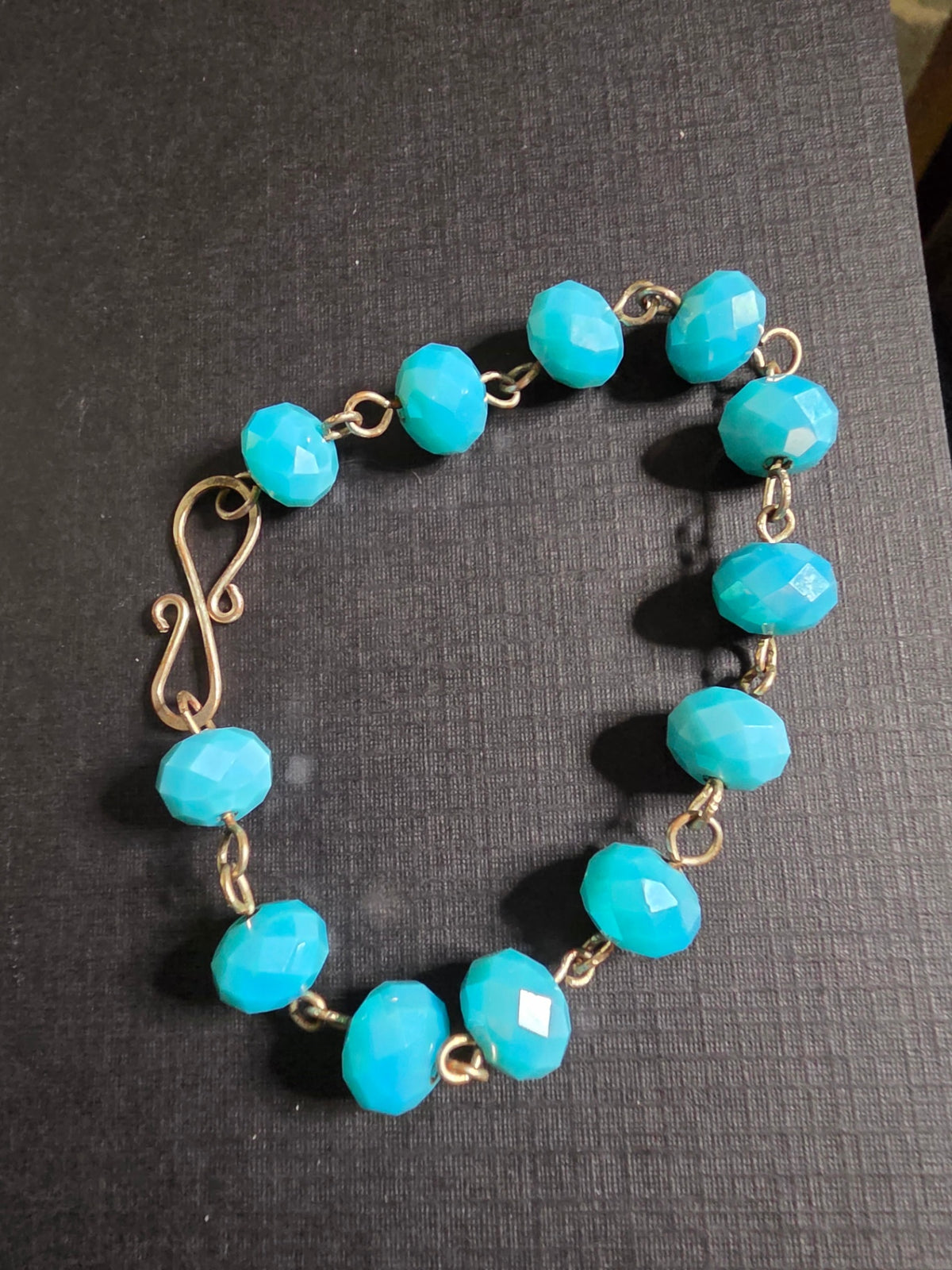 14B ss wire wrapped w/blue crystal rondelles