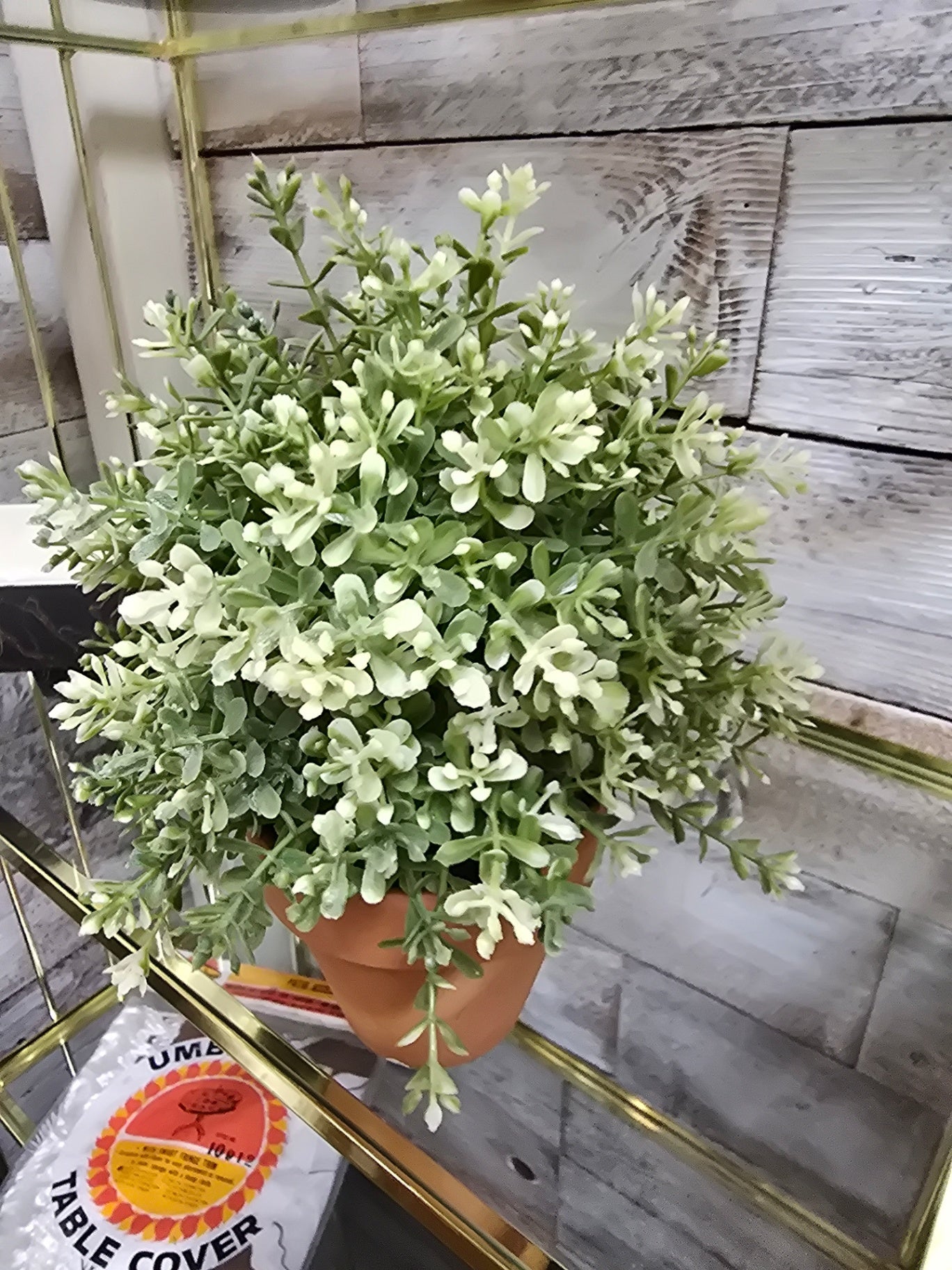 Faux plant in pot