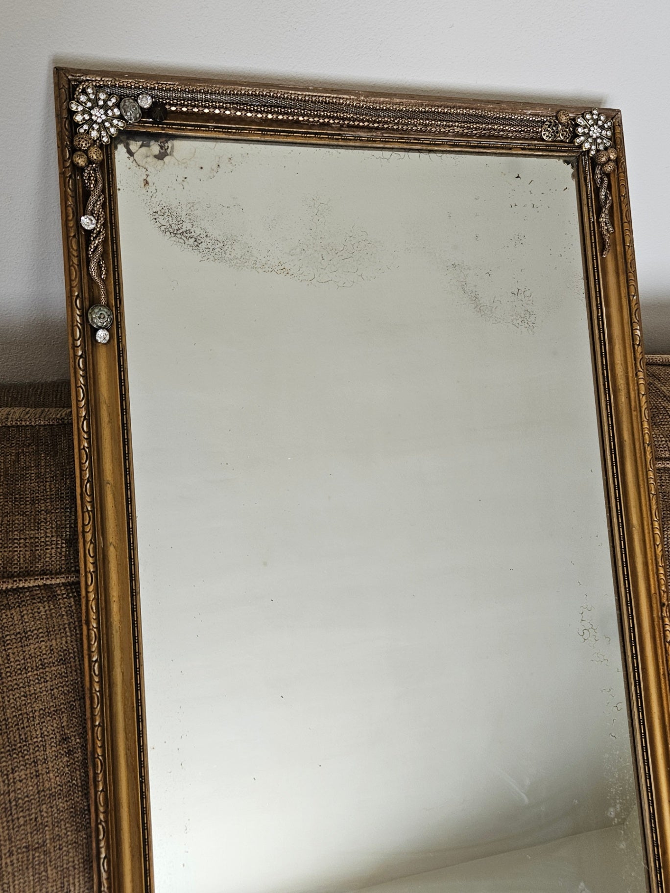 Vintage gold framed mirror with jewelry embellishments