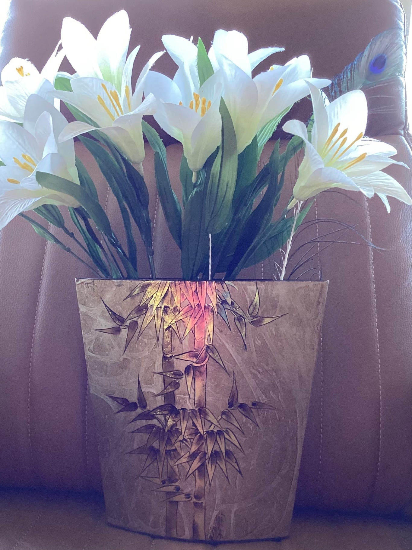 Bouquet of lilies in gold lacquer vase