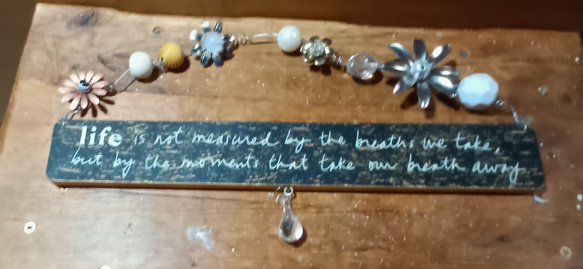 Sentiments hanging sign 