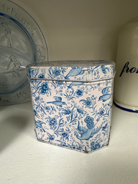 Small blue and white tin