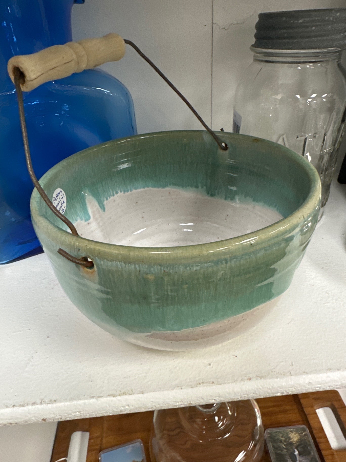 Hand thrown pottery bowl with handle